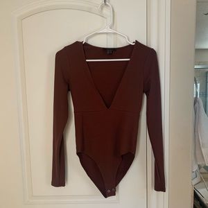 Rust colored body suit